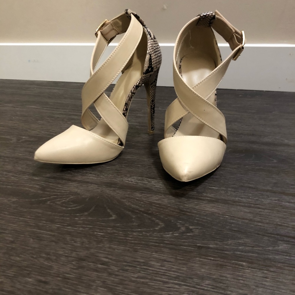 Nude/snakeskin pumps.